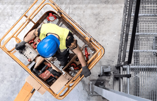 worker on construction lift