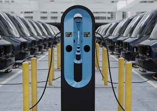 Man at electric charging station