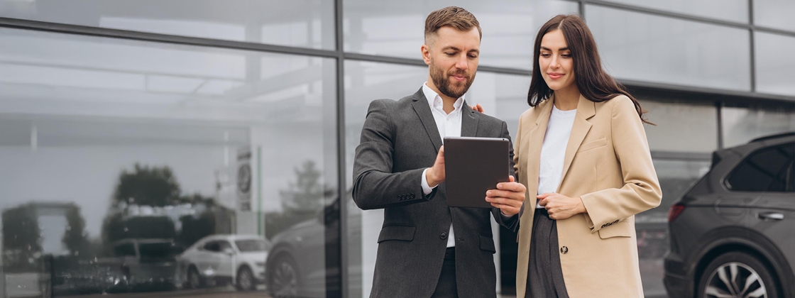 Two people reviewing the 2024 Q4 fleet trends report